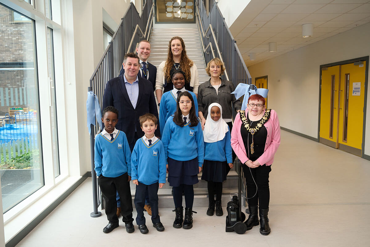 H&F Leader Cllr Stephen Cowan (left), H&F Mayor Cllr Patricia Quigley (right), school staff and pupils at the official opening of Ark White City Primary Academy's new building