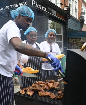 Three chefs barbequing at Wandsworth Bridge Road's 2023 fayre
