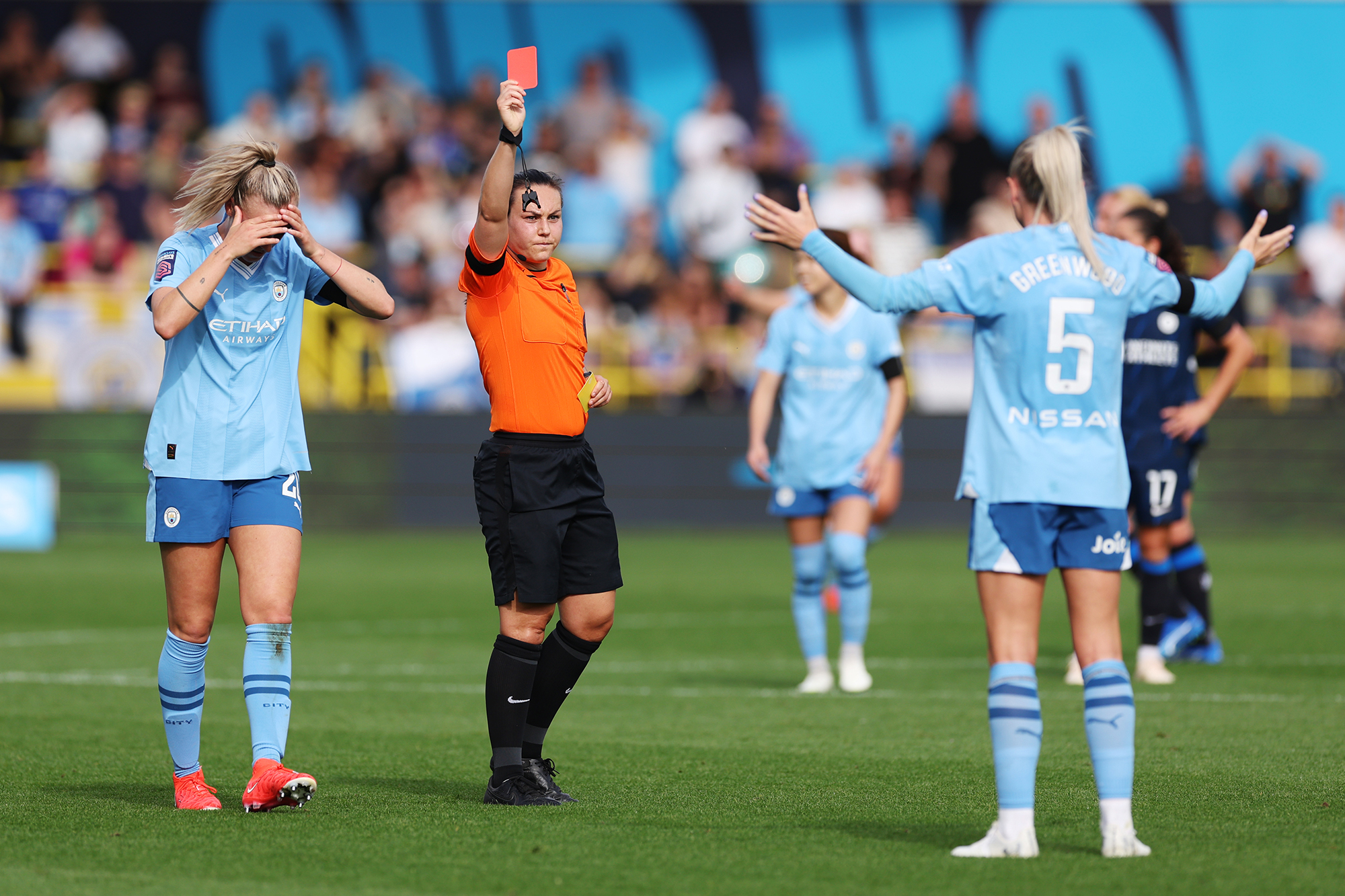 Man City's Alex Greenwood receives a controversial red card for time-wasting in the game against Chelsea