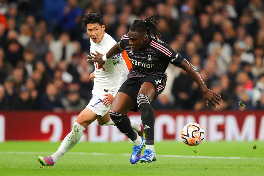 Fulham defender Calvin Bassey battles Son Heung-Min of Tottenham for possession of the ball.