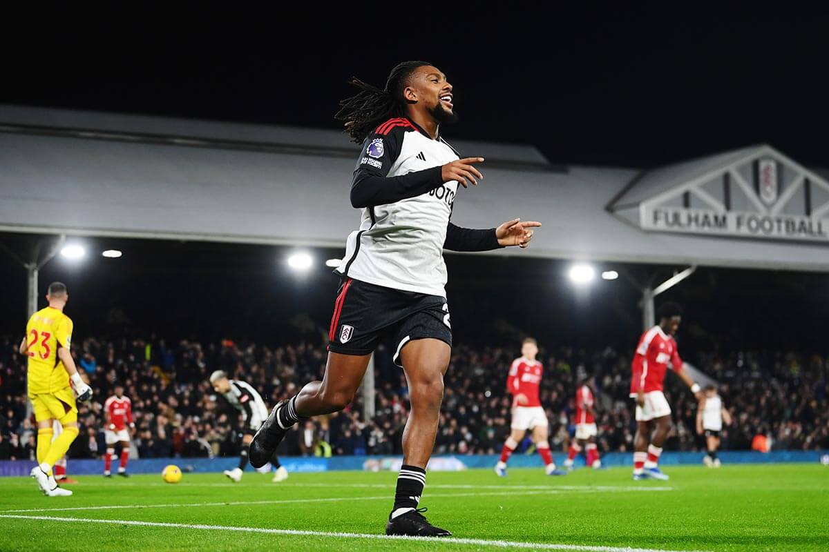 Alex Iwobi celebrates scoring Fulham's fourth goal against Forest
