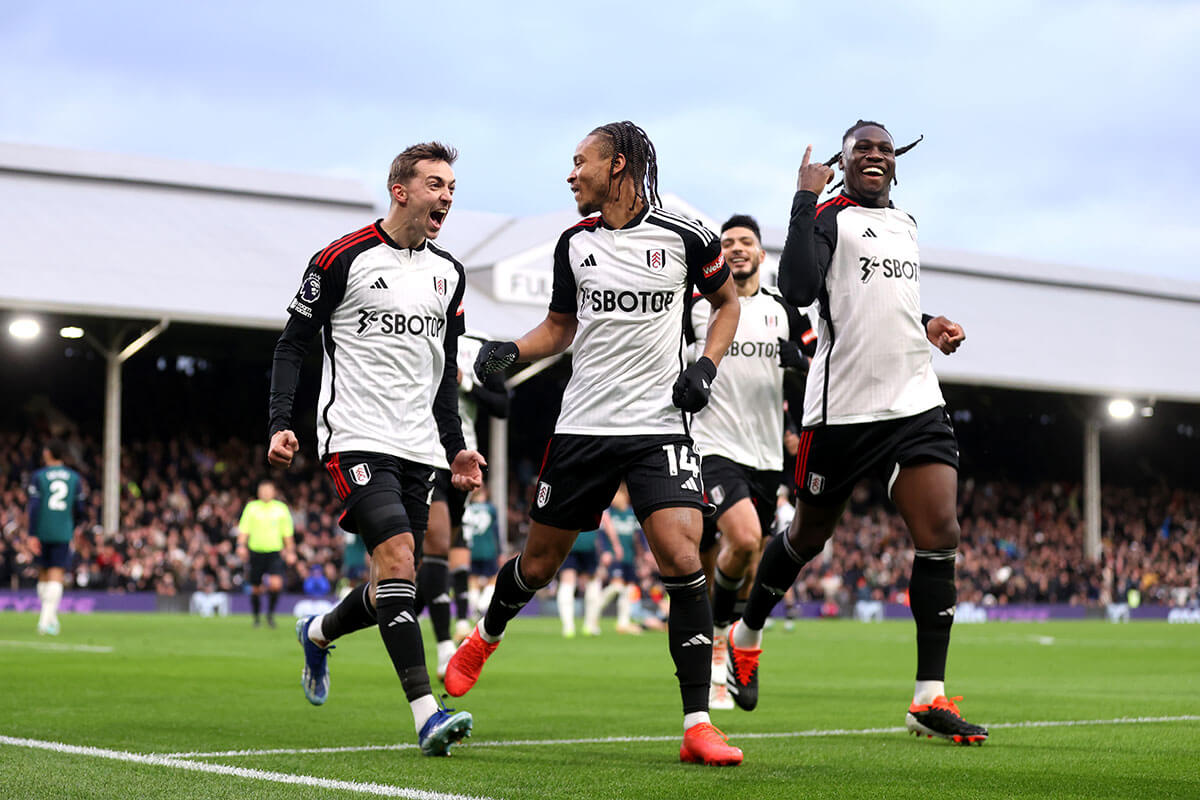 Fulham's Bobby Reid (centre) celebrates with Calvin Bassey and Timothy Castagne after scoring his winning goal against Arsenal