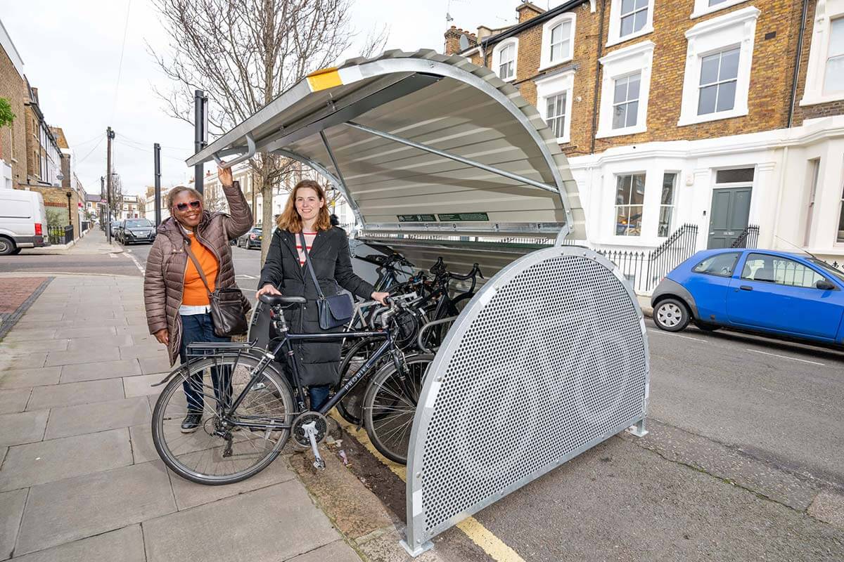 Cllr Sharon Holder (left) and Eloise Illingworth (right) at the new cycle hangar in Overstone Road
