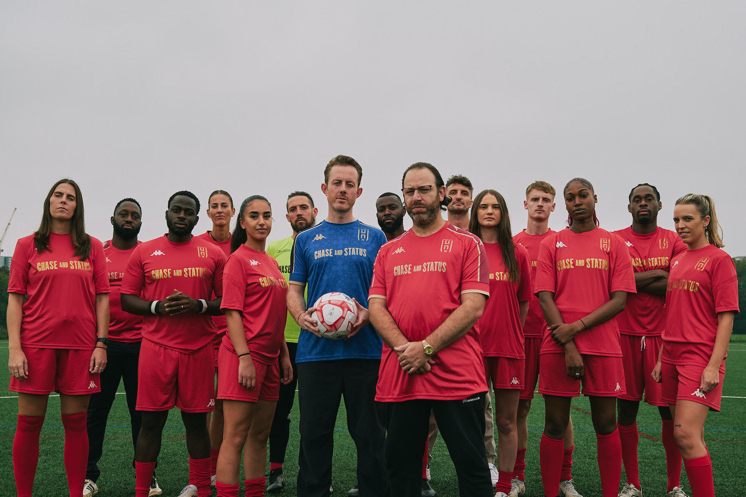 Chase & Status with players from the Hammersmith FC men and women's teams.