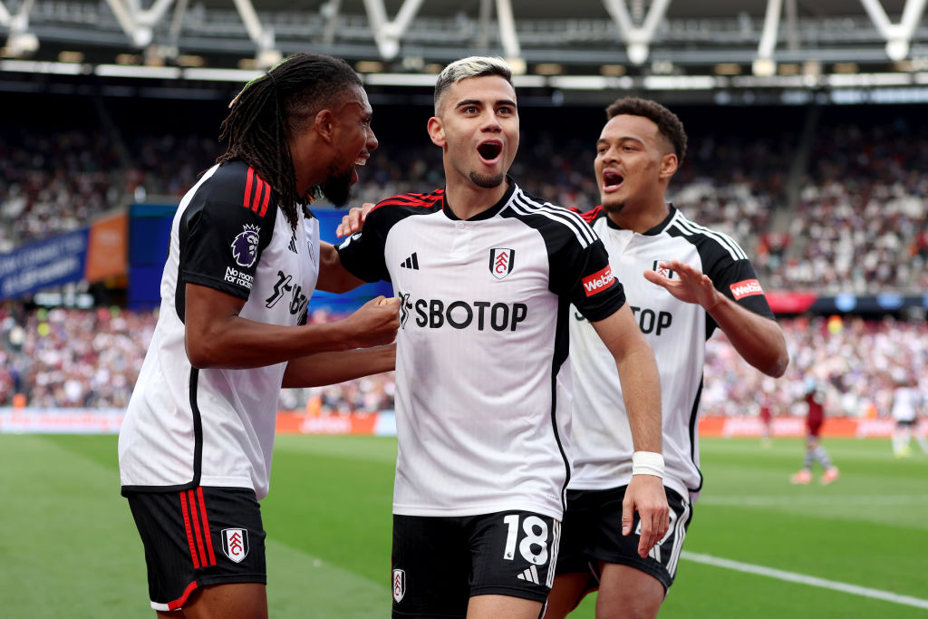 Andreas Pereira (centre) celebrates scoring Fulham's second goal against West Ham with Alex Iwobi and Rodrigo Muniz