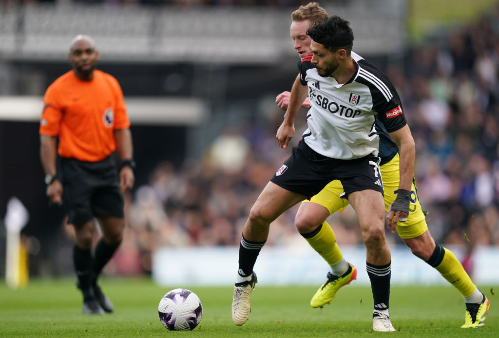 Raúl Jiménez of Fulham under pressure from Sean Longstaff of Newcastle United
