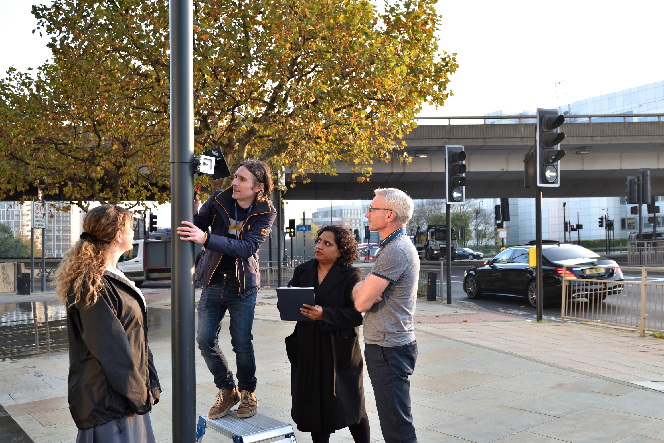 Research team install air quality monitor