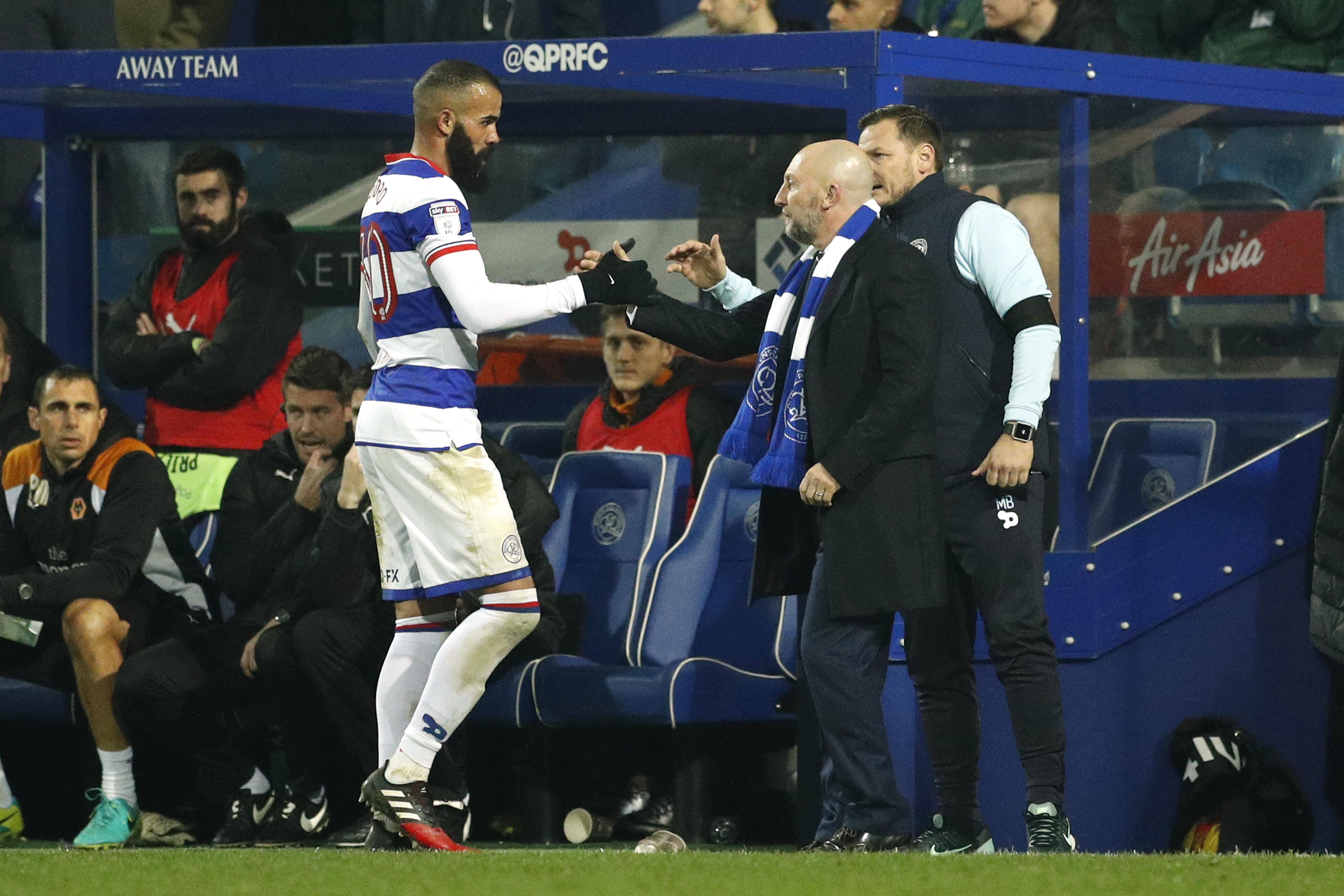QPR's Sandro with manager Ian Holloway as he is substituted