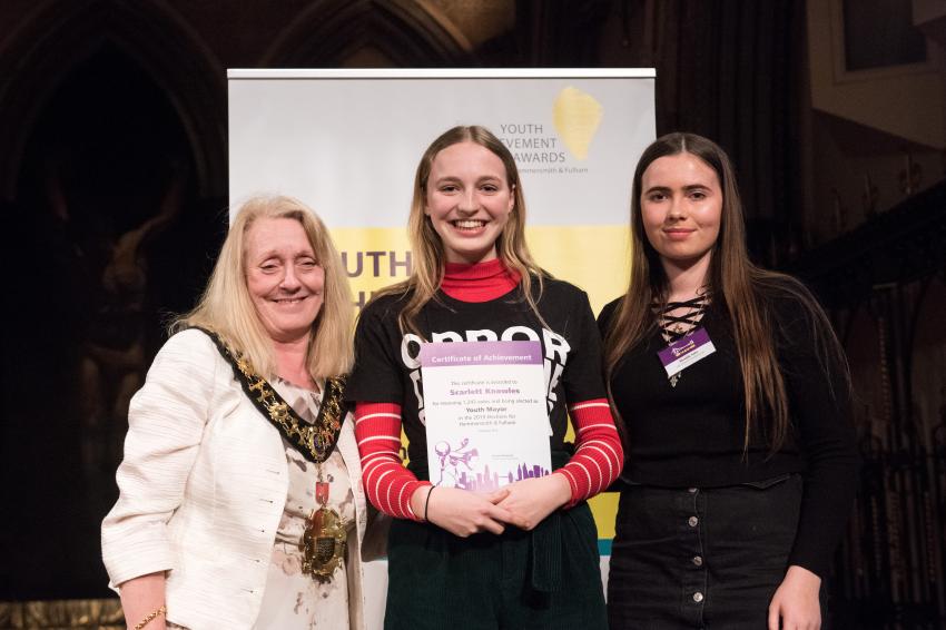 H&F Youth Mayor Scarlett Knowles being presented with a Youth Achievement Award certificate at a ceremony in 2019