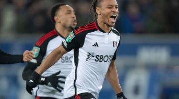 Bobby De Cordova-Reid and Kenny Tete celebrate after Fulham's winning penalty