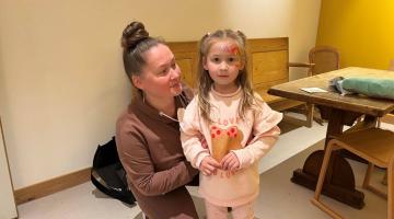 Mariia and her four-year-old daughter, Emilia, at the Quaker Meeting House in Hammersmith