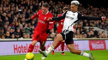 Fulham's Joao Palhinha (right) challenges Liverpool's Ryan Gravenberch at Craven Cottage