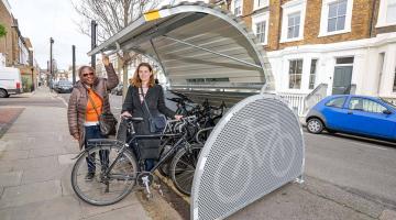Cllr Sharon Holder (left) and Eloise Illingworth (right) at the new cycle hangar in Overstone Road