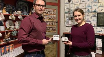 Mudlark Jason Sandy (left) donating Doves Type to Emery Walker's House curator Mallory Horrill (right)