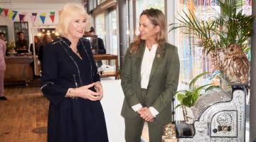 Queen Camilla with artist Cordelia Plunket (right) at Kindred Studios