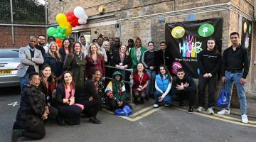 Some of H&F's young care leavers with Cllr Alex Sanderson (centre) outside their new hub, 2023