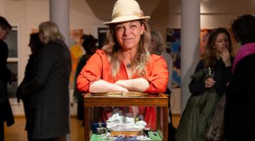 Kindred Studios artist Cordelia Plunket with her replica of Tracey Emin's 'My Bed'