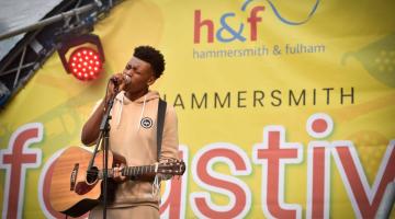 Performer on stage at Hammersmith summer street festival