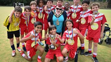 Fulham's Holy Cross boys celebrate their win with Cllr Patricia Quigley (centre), Mayor of H&F