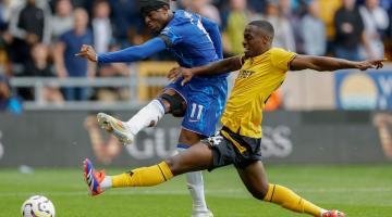 Noni Madueke scores his second goal past Toti Gomes of Wolverhampton Wanderers