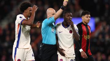 Referee Anthony Taylor shows one of many yellow cards