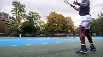 Residents playing tennis at Hammersmith Park's new tennis courts