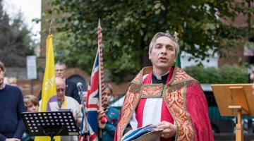 Fr Ross Gunderson leads the service of dedication