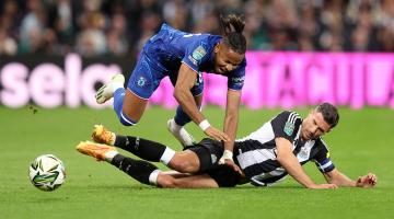 Chelsea's Christopher Nkunku is fouled during the Carabao Cup game at St James' Park