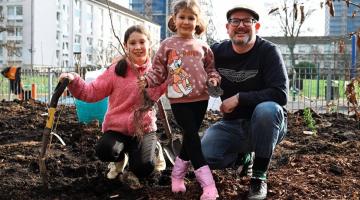 One local family joins in the planting at Norland Open Space