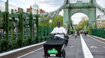 Residents cycle across Hammersmith Bridge