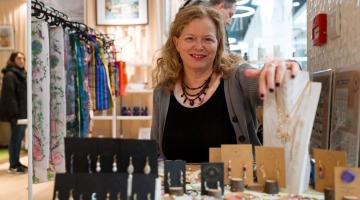 Jenny Palmer, founder of Clarke Palmer, with her products in store, December 2024