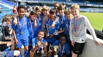 Competition winners Larmenier & Sacred Heart holding their trophies