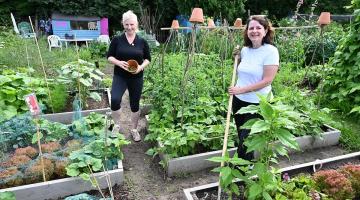 Emma Walker and Rose Craston working on their allotment