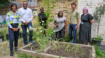Cllr Frances Umeh (left), Cabinet Member for Housing and Homelessness, with St Mungo's staff at homeless supported accommodation in Fulham