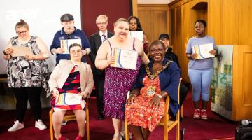 Mayor of H&F, Cllr Sharon Holder (seated right), with students receiving awards