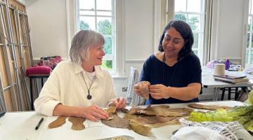 Amarjeet Nandhra (right) teaching a hand stitching class