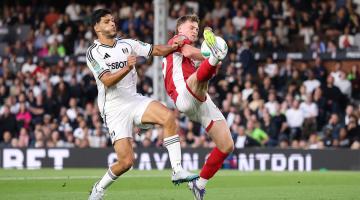 George Tanner of Bristol City (right) scores an own goal whilst under pressure from Raul Jimenez (left)