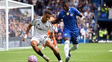 Joshua King is challenged by Moises Caicedo