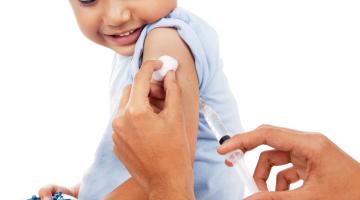 A young boy receiving a polio injection.