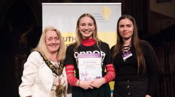 H&F Youth Mayor Scarlett Knowles being presented with a Youth Achievement Award certificate at a ceremony in 2019