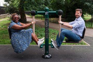 Cllr Sharon Holder (left), H&F Cabinet Member for Public Realm, and Dario Vianello (right), Friends of Hammersmith Park Japanese Garden, on the seated leg press
