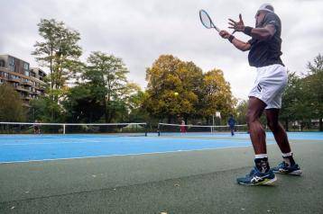 Residents playing tennis at Hammersmith Park's new tennis courts