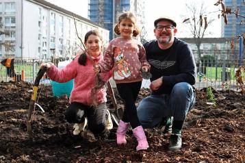 One local family joins in the planting at Norland Open Space