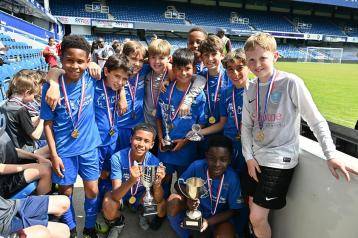 Competition winners Larmenier & Sacred Heart holding their trophies