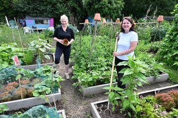 Emma Walker and Rose Craston working on their allotment