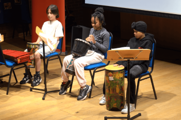 Three young carers perform at their summer showcase