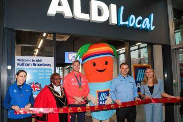 L-t-r (centre): H&F Mayor Cllr Sharon Holder and Olympic gold medallist Rory Gibbs join store manager David Murray for the unveiling of the new ALDI store in Fulham Broadway centre