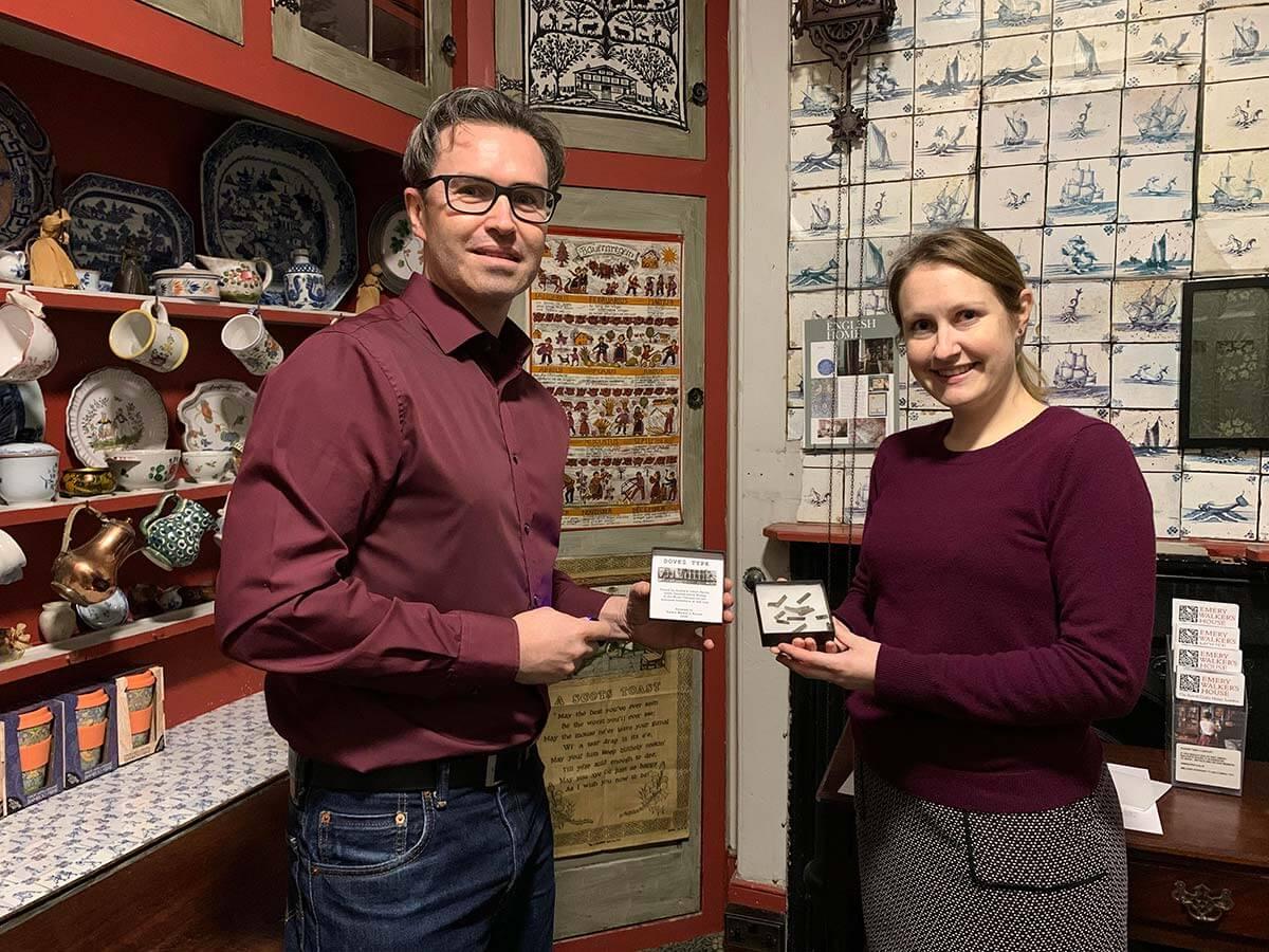 Mudlark Jason Sandy (left) donating Doves Type to Emery Walker's House curator Mallory Horrill (right)