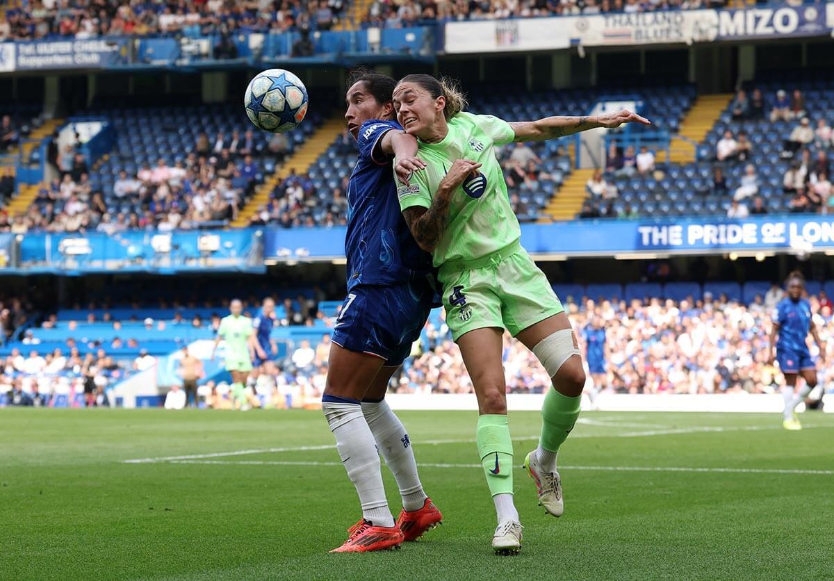 Mayra Ramirez battles for possession with Maria Leon
