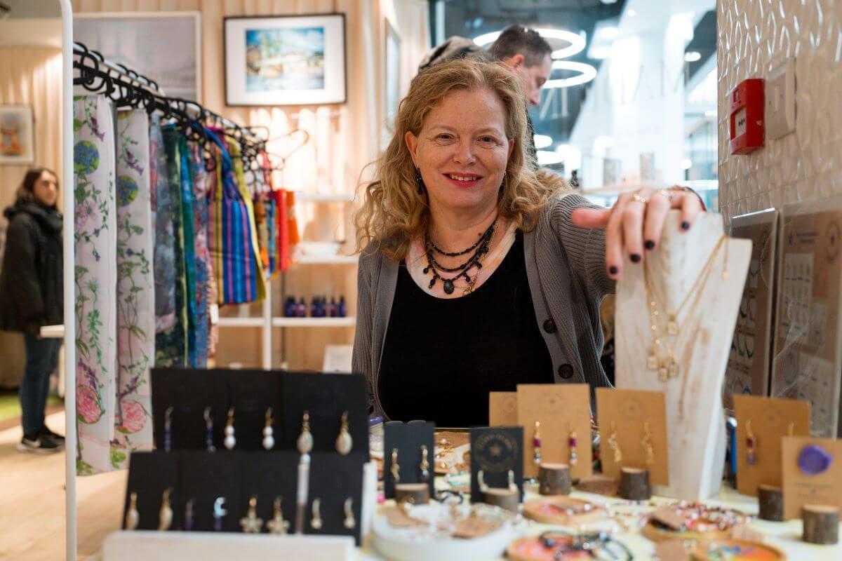 Jenny Palmer, founder of Clarke Palmer, with her products in store, December 2024